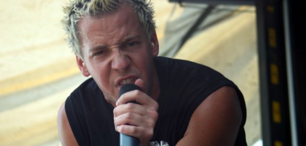 ORLANDO, FL - JULY 24: Lead singer of Simple Plan rocks out at the Vans Warped tour at the Central Florida Fair Grounds on July 24, 2003 in Orlando, Florida.  (Photo by Kellie Warren/Getty Images)